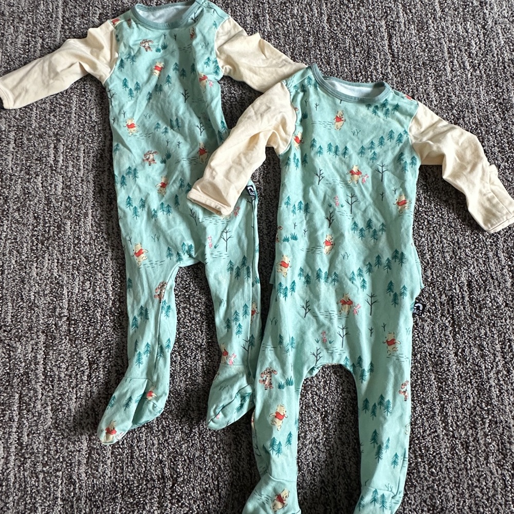 Winnie the Pooh 0-3 months pajamas (2 pair). Super stretchy w peek a booty back.